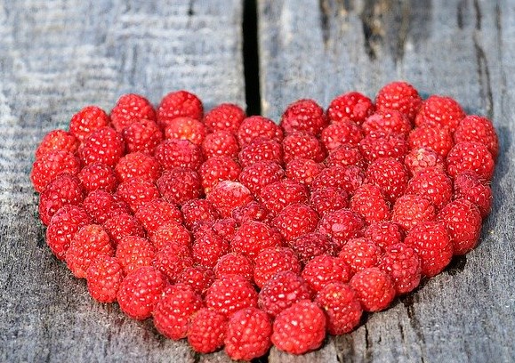 A picture containing red, building, berry

Description automatically generated