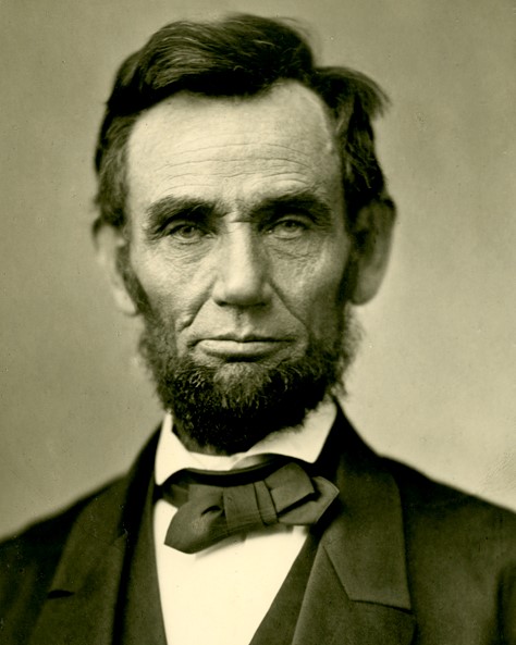 A person wearing a suit and tie

Description automatically generated